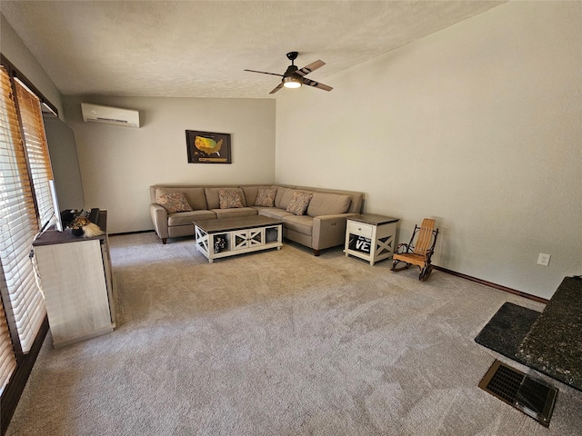 1103 Greers Ferry Rd, Libby, MT 59923 - living area with carpet, a wall mounted AC, ceiling fan, baseboards, and a textured ceiling