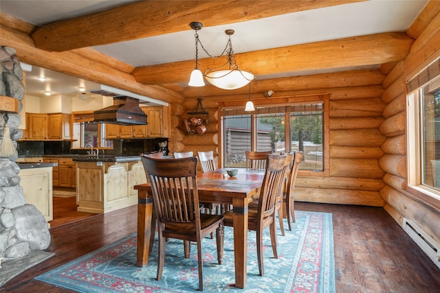 dining area with rustic walls, dark wood-style floors, a baseboard heating unit, and beam ceiling