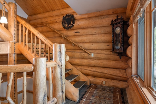 staircase with wood ceiling