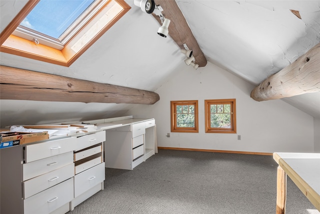 bonus room featuring lofted ceiling with skylight, carpet, and baseboards