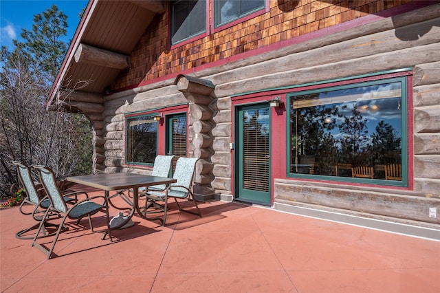 view of patio featuring outdoor dining area