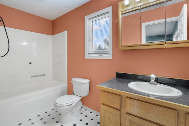 bathroom featuring toilet, vanity, and shower / tub combination