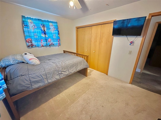 bedroom with a closet, carpet, and ceiling fan