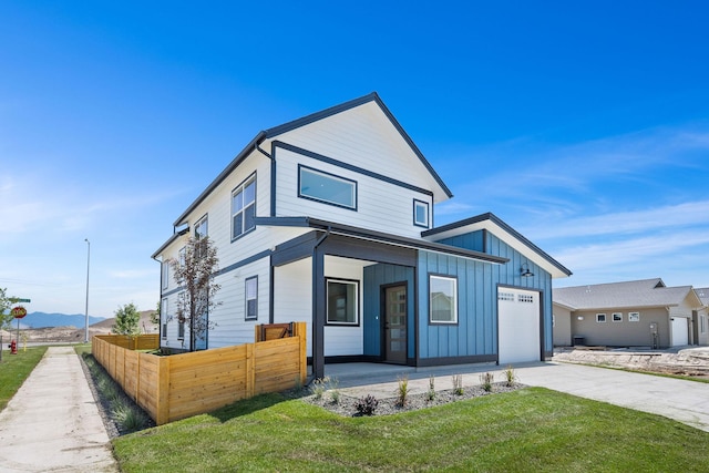 590 Stillwater Rd, Kalispell, MT 59901 - view of front facade featuring board and batten siding, driveway, and a garage