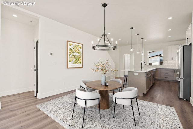 590 Stillwater Rd, Kalispell, MT 59901 - dining room with wood finished floors, recessed lighting, and a chandelier