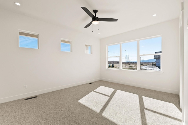 unfurnished room with light carpet, visible vents, recessed lighting, and baseboards