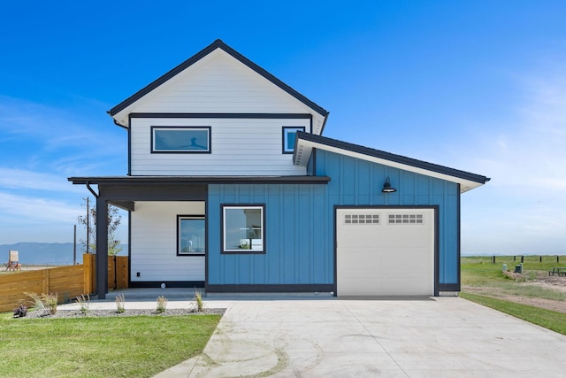 590 Stillwater Rd, Kalispell, MT 59901 - view of front of house featuring concrete driveway and board and batten siding