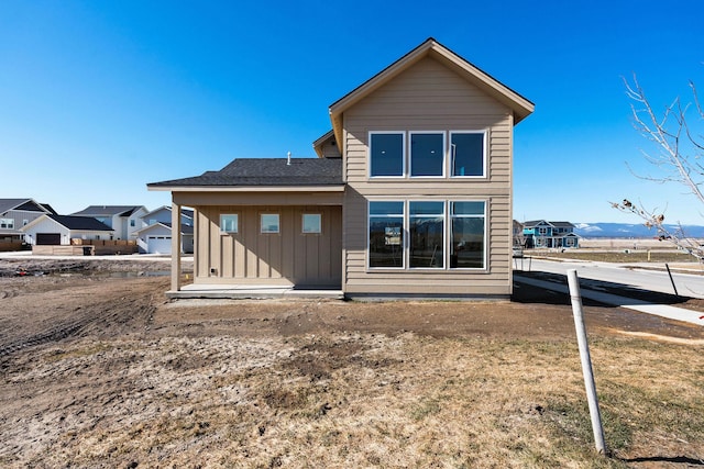 back of property with board and batten siding