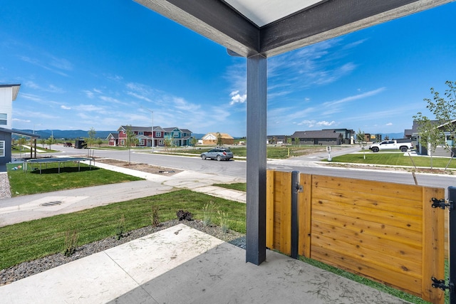 590 Stillwater Rd, Kalispell, MT 59901 - view of patio / terrace featuring a trampoline and a residential view