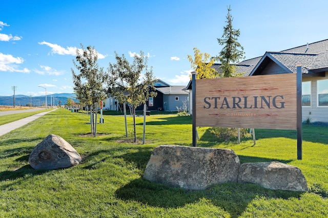 590 Stillwater Rd, Kalispell, MT 59901 - community / neighborhood sign featuring a lawn and a mountain view