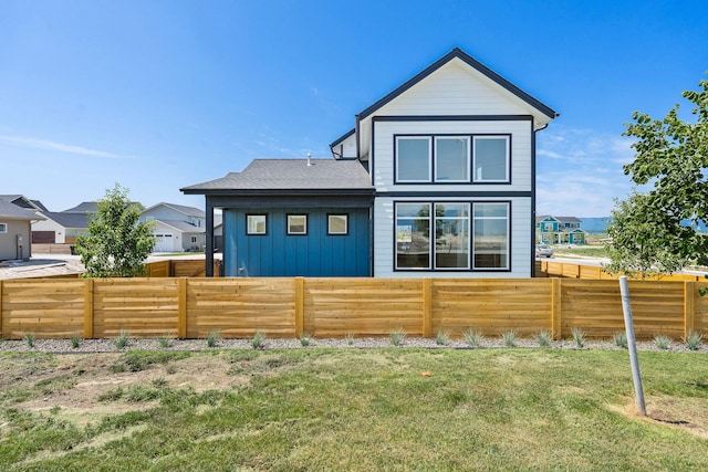 590 Stillwater Rd, Kalispell, MT 59901 - back of property with board and batten siding and a residential view