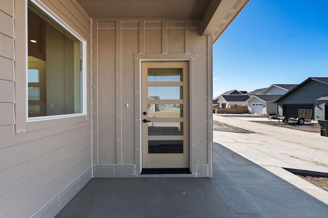 view of exterior entry with a residential view