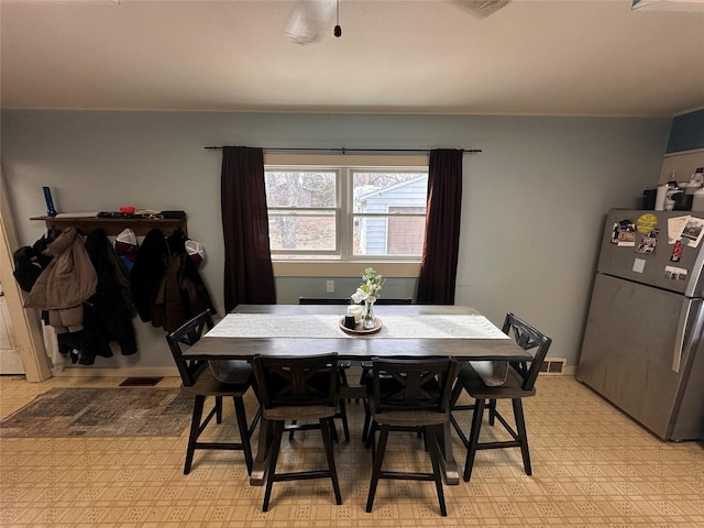 dining room with visible vents and baseboards