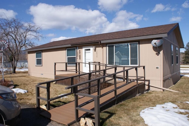 view of front of property featuring crawl space, a wooden deck, and a shingled roof