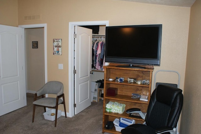 office area featuring baseboards, visible vents, and carpet floors