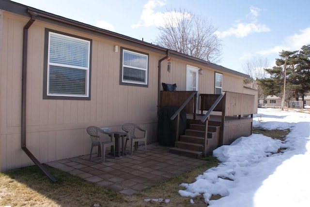 rear view of property featuring a patio