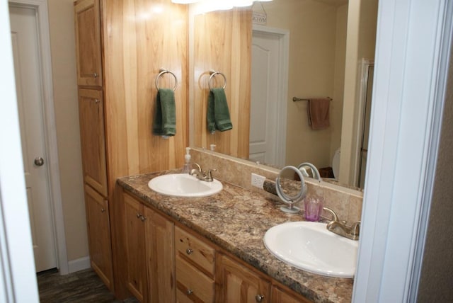 bathroom with double vanity and a sink