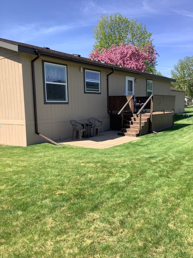 12836 Camerons Way, Lolo, MT 59847 - rear view of property featuring a yard and a patio area