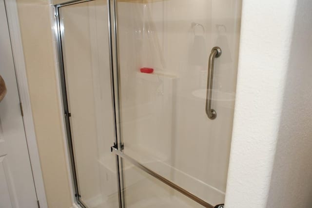 full bathroom with a stall shower