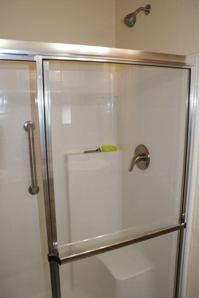 full bathroom featuring a stall shower