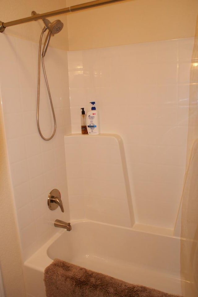 bathroom with shower / bathing tub combination