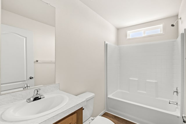 full bathroom featuring shower / tub combination, toilet, vanity, and wood finished floors