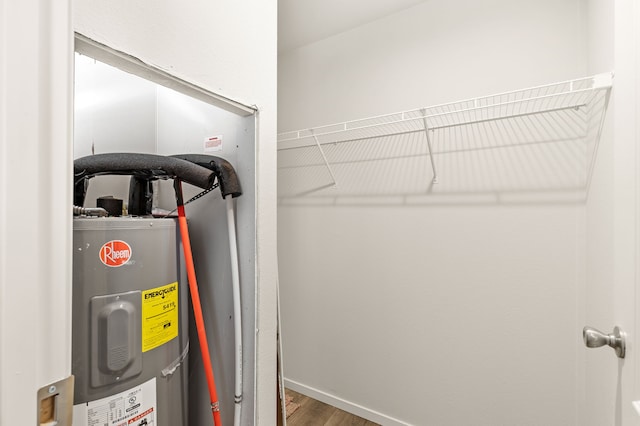 utility room with electric water heater