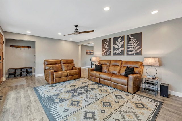 living area with recessed lighting, wood finished floors, baseboards, and ceiling fan