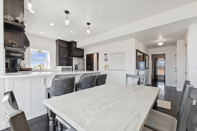 dining area featuring dark wood-type flooring, recessed lighting, and baseboards