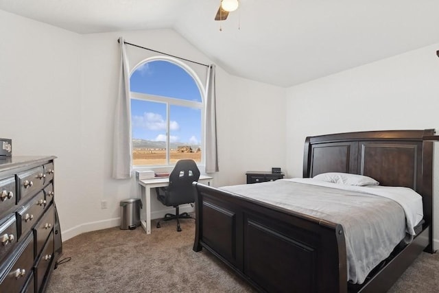 bedroom featuring baseboards, lofted ceiling, light colored carpet, and ceiling fan