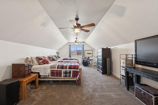 carpeted bedroom with a textured wall, a textured ceiling, lofted ceiling, and a ceiling fan