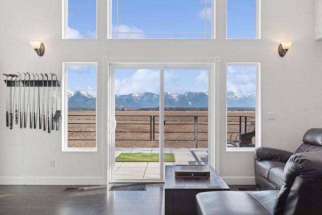 doorway to outside with plenty of natural light and a mountain view