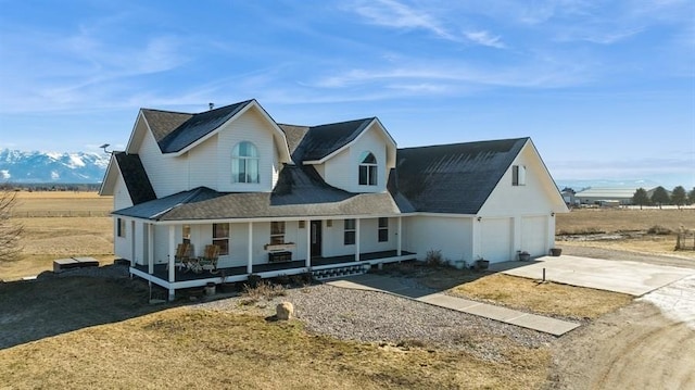 view of front of property featuring covered porch and driveway