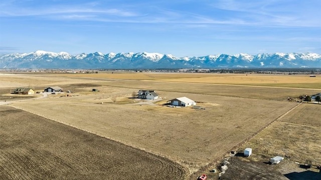 drone / aerial view featuring a mountain view and a rural view