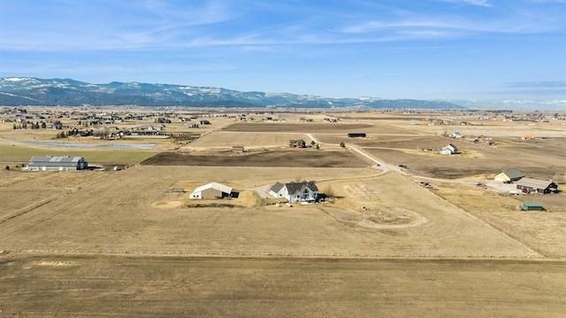 drone / aerial view featuring a rural view and a mountain view