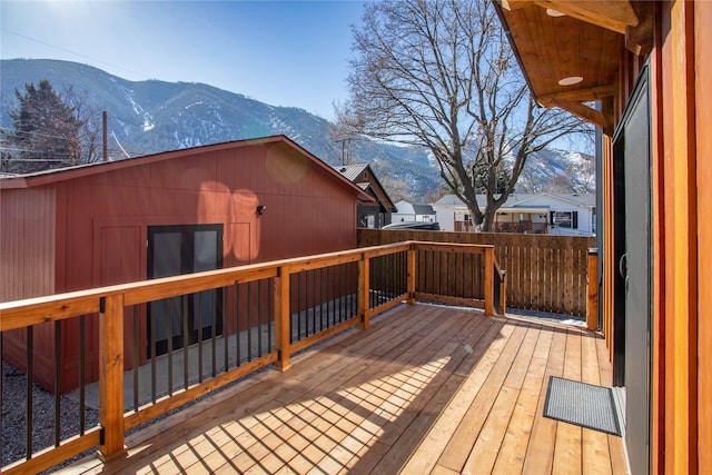 deck with a mountain view and fence