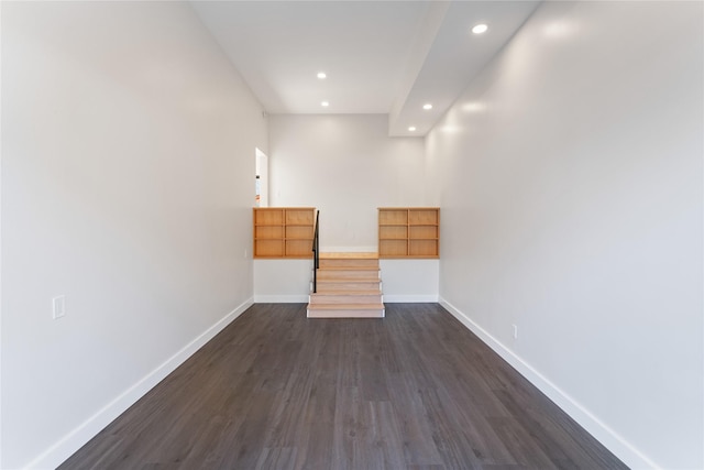 spare room with dark wood-style floors, recessed lighting, and baseboards