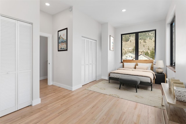 bedroom featuring recessed lighting, baseboards, and light wood-style flooring