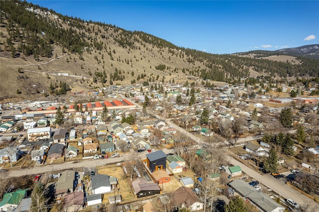 birds eye view of property with a mountain view and a residential view