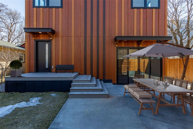 view of patio / terrace featuring outdoor dining area and fence