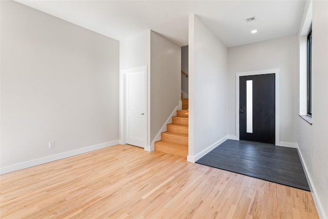 entrance foyer with stairway, wood finished floors, visible vents, baseboards, and recessed lighting