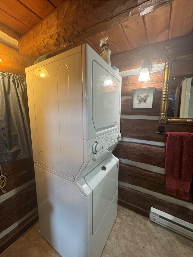 bathroom with wood ceiling, stacked washer and clothes dryer, and wood walls