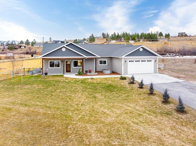 single story home with a front yard, an attached garage, driveway, and fence