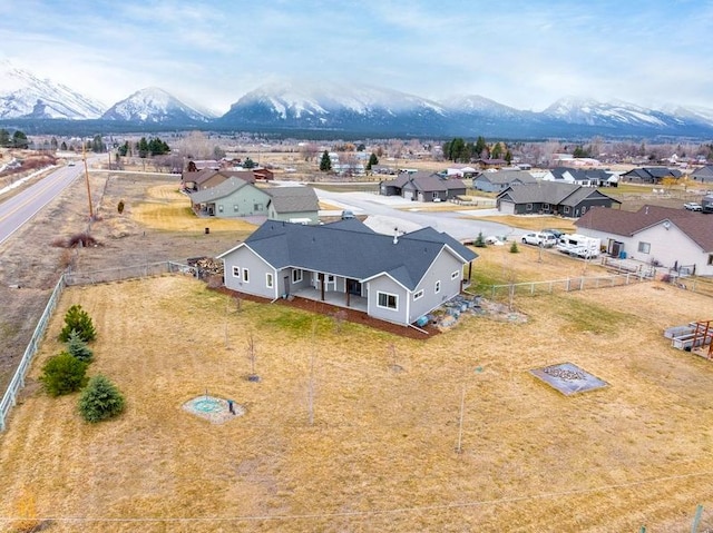 birds eye view of property with a residential view and a mountain view