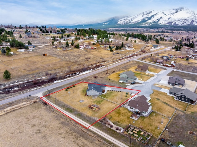 drone / aerial view featuring a mountain view