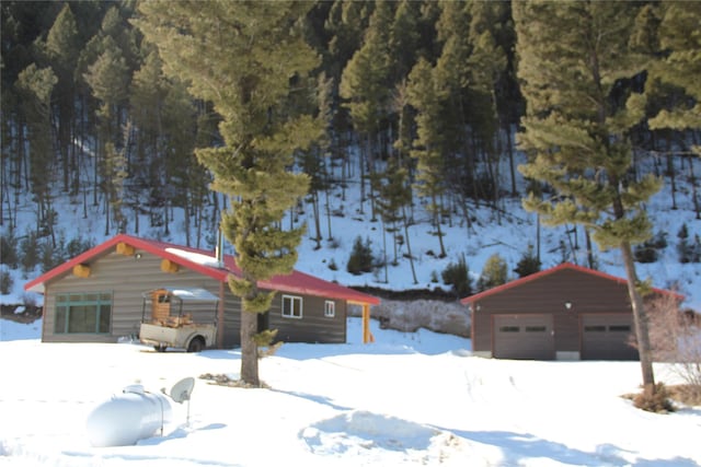 view of front of home with an outbuilding and a garage