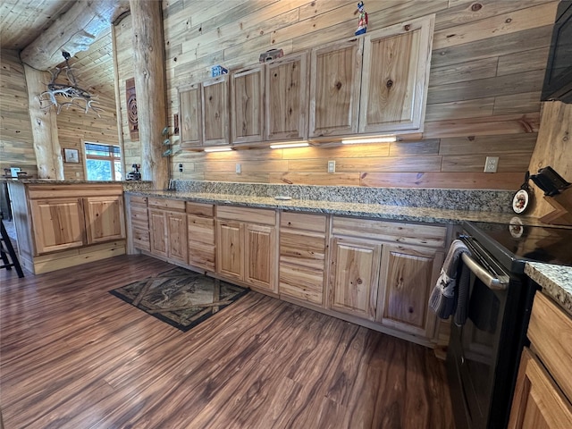 kitchen with light brown cabinetry, black range with electric cooktop, wooden walls, wooden ceiling, and dark wood-style flooring