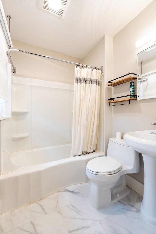 bathroom featuring toilet, shower / bath combo, visible vents, and marble finish floor