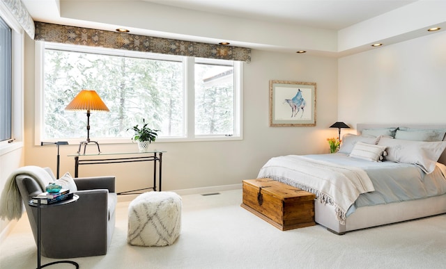 carpeted bedroom featuring recessed lighting, visible vents, and baseboards