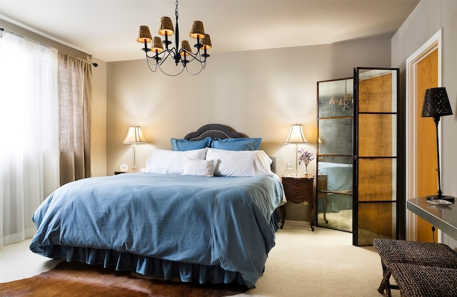 bedroom featuring carpet and a chandelier